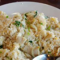 Kow Pad · Thai style fried rice with egg, onions, peas, and carrot.
