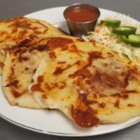 Only Beans Order Of 3 · A plate of three bean pupusas. Served with a side of our homemade curtido(slaw) and sauce.