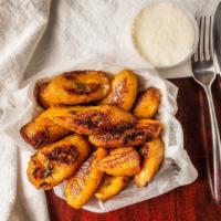 Fried Plantains · This sweet dish has about 8 to 10 pieces of plantains that are fried with a side of sour cre...