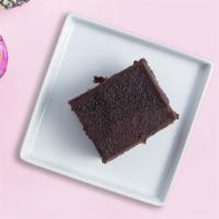 Indulgent Chocolate Cake · Rich round chocolate ganache fudge cake.
