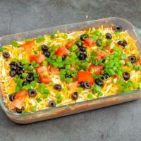 7 Layer Dip (Half Pan)  · Refried beans, sour cream, taco sauce, shredded cheese, diced tomatoes, black olives, and gr...