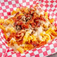 Loaded Breakfast Fries · Waffle fries or home fries topped with cheese bacon crumbled sausage and gravy.