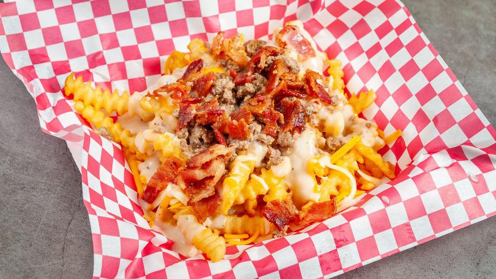 Loaded Breakfast Fries · Waffle fries or home fries topped with cheese bacon crumbled sausage and gravy.