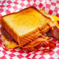 Breakfast Sandwich · Choice of bacon or sausage w/ egg and cheese on texas toast