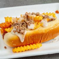 Breakfast Dog · topped with shredded cheese crinkle cut fries white gravy and sausage crumbles