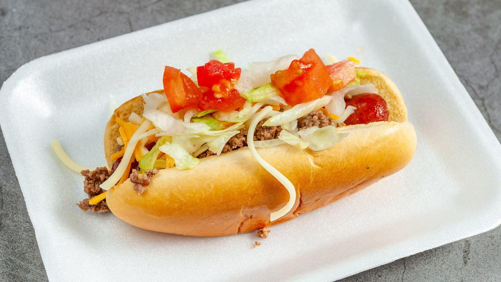 Taco Dog · topped with taco meat shredded cheese lettuce diced tomatoes and salsa