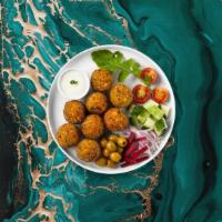 Falafel · Baked and fried mixture of garbanzo beans, fava beans, coriander, cumin, parsley and onions....