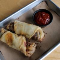 Vegan Egg Rolls · Filled with chili-spiced black beans, cabbage, carrots, corn, rice noodle, green onion, and ...