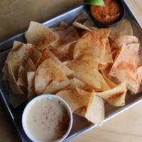 Chips, Queso, & Salsa · Freshly fried corn chips, white queso, and house-made roasted salsa.