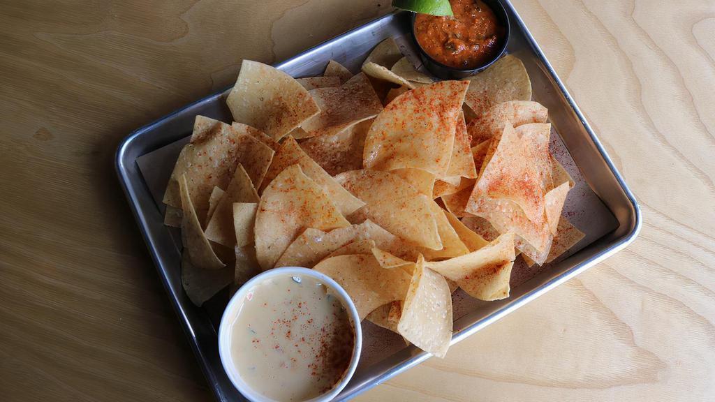 Chips, Queso, & Salsa · Freshly fried corn chips, white queso, and house-made roasted salsa.