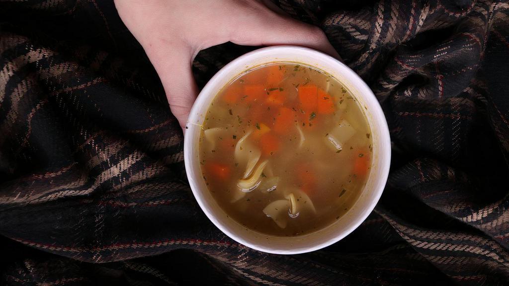 Chicken Noodle Soup · Homemade stock. Carrots. Celery. Classic. Served with a piece of baguette.
