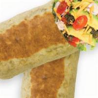 Cilantro Chicken · Chicken wrap with sliced tomatoes, cheddar cheese, romaine, avocado, and spicy cilantro sauc...