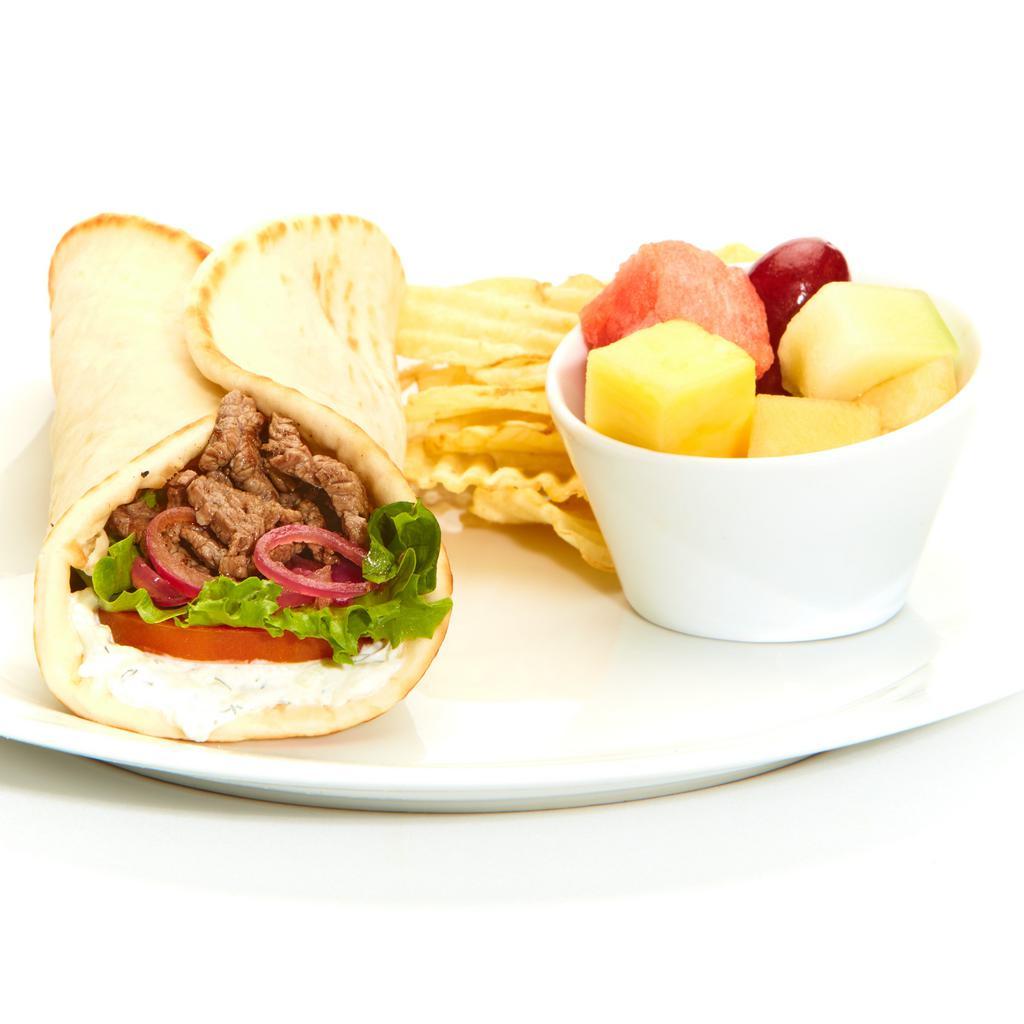 Grilled Beef Tender Gyro · Taziki sauce, tomatoes, mixed lettuce, and grilled onions with Chips and your choice of a Homemade Side.