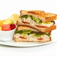 Chicken Salad Sandwich · Scratch-made Chicken Salad with mixed lettuce and tomato on toasted bread. Served with Chips...