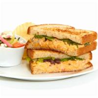 Spicy Pimento Cheese Sandwich · With mixed lettuce on toasted bread. Served with Chips and your choice of a Homemade Side.