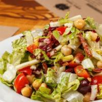 Chop Salad · Chopped romaine and radicchio tossed with salami, mozzarella, tomato, kalamata olives, and g...