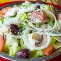 House Salad · Romaine lettuce with tomatoes, onion, mushrooms, and kalamata olives topped with pecorino ro...