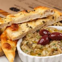 Eggplant Dip · Roasted eggplant seasoned and served with house made bread.