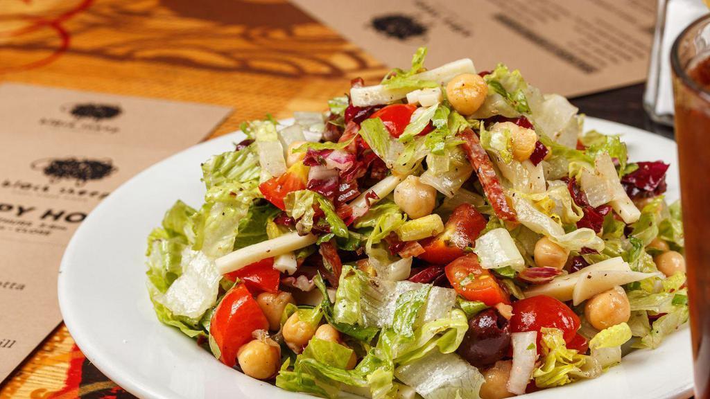 Side Chop Salad · Chopped romaine and radicchio tossed with salami, mozzarella, tomato, kalamata olives, and garbonzo beans. Served with red wine vinaigrette on the side.