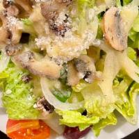 Side House Salad · Romaine lettuce with tomatoes, onion, mushrooms, and kalamata olives topped with pecorino ro...