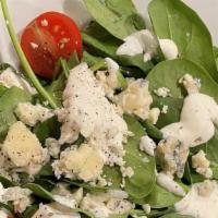 Side Spinach Salad · Spinach topped with fresh tomato and blue cheese crumbles. Buttermilk dressing served on the...