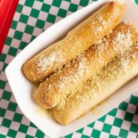 Bosco Breadsticks · Breadsticks stuffed with mozzarella, baked, topped with Parmesan and butter and served with ...