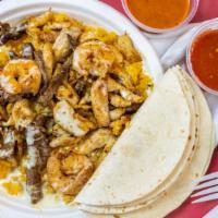 Salsa'S Special · Grilled chicken, steak, and shrimp with cheese dip & a side of rice. Also served with tortil...