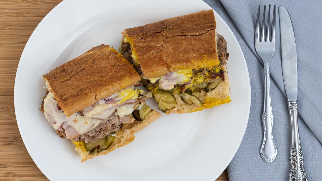 Cuban · Ham, pulled pork, mustard, pickles and swiss cheese.