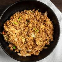 Kow Pad · Thai style fried rice with eggs, onions, green peas, and carrots.