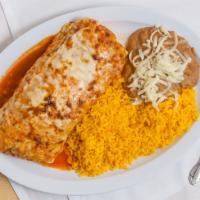 Burrito Suizo Dinner · Contains beans, lettuce, tomato, onions, cheese, sour cream topped with ranchera sauce and m...