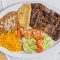 Bistek A La Tampiquena Dinner · Tender skirt steak, 1 cheese enchilada & 1 quesadilla with rice, beans, salad and tortillas ...