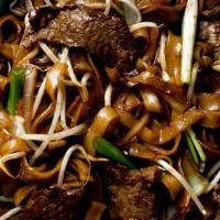 # Beef Ho Fun · Stir-fried with green onions, bean sprouts & dark soy sauce, served with wide rice noodles.