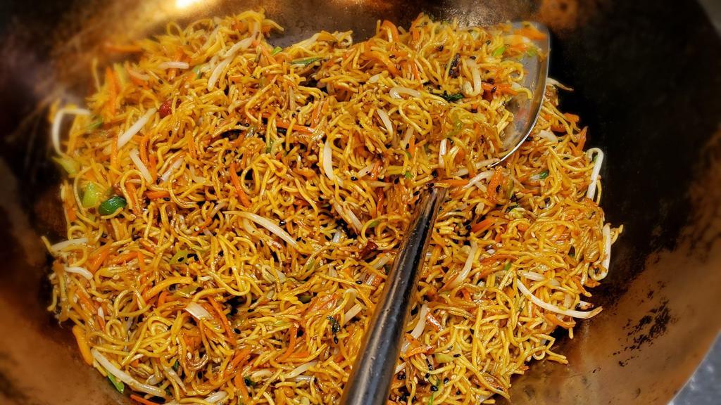 Vegetarian Sesame Noodles · Wok fried chow mein noodles with carrot, bean sprouts, green onion & peppers with sesame sauce.