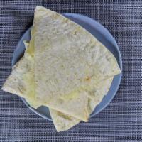Chicken Quesadilla · Grilled chicken breast with melted cheese, onions and peppers all between two large flour to...
