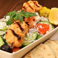 Large Greek Salad · Crisp Romaine Hearts, Fresh Tomatoes, Cucumbers, Red Onions, Kalamata Olives, Greek Feta and...