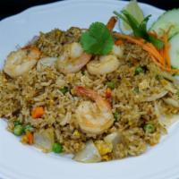 Thai Fried Rice · Curry flavored rice with shrimp, pineapple, eggs, cashews and veggies.