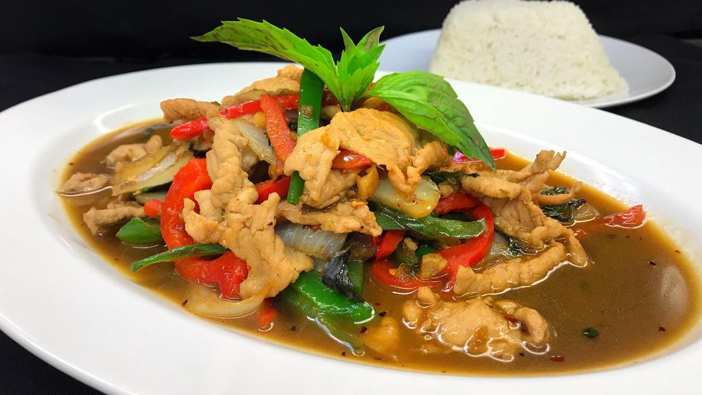 Pad Kra Prow · Stir-fried meat in a spicy sauce with green bean, onion, bell pepper, and basil.