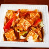 Red Curry · Slice meat in red curry with coconut milk, bamboo shoot, bell pepper, green bean, and basil.