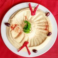 Hummus · Denotes vegetarian selections. Chickpeas puréed with tahini sauce, lemon juice and a hint of...