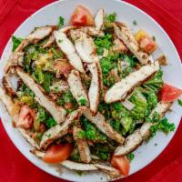 Fattoosh Tawook Salad · Large salad mixed with toasted pita and topped with char-grilled chicken breast.