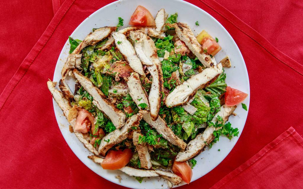 Fattoush Tawook Salad · Most popular. Large salad mixed with toasted pita and topped with char grilled chicken breast.