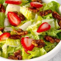 Strawberry Walnut · Gluten friendly. Romaine blend with candied walnuts and sliced strawberries, tossed with ras...
