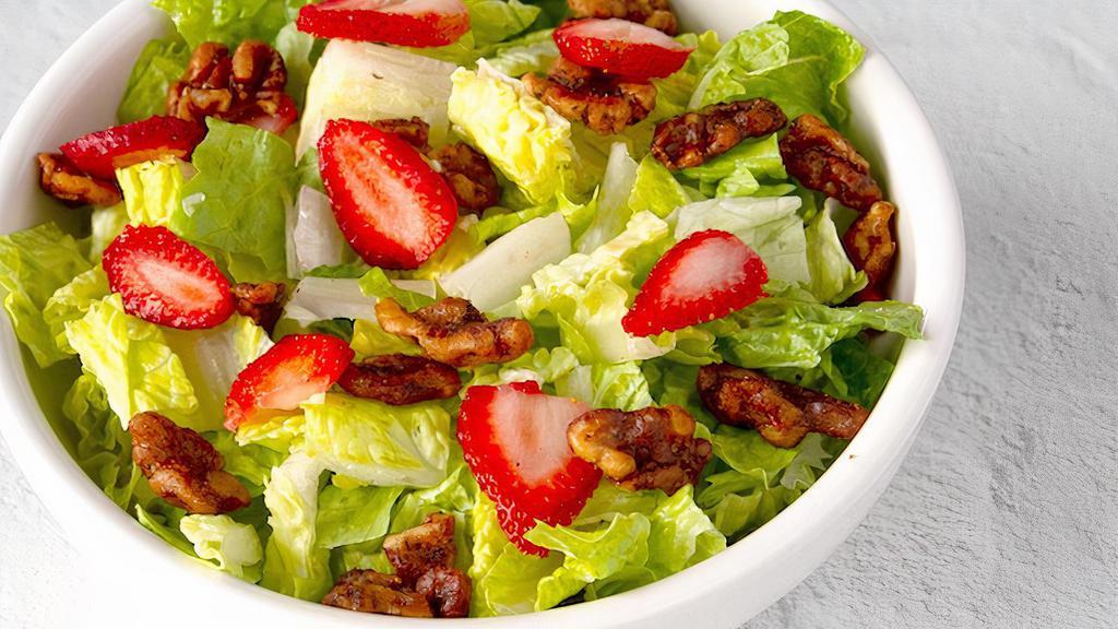 Strawberry Walnut · Gluten friendly. Romaine blend with candied walnuts and sliced strawberries, tossed with raspberry vinaigrette dressing.