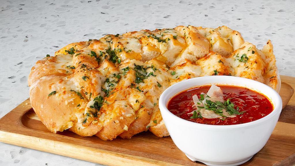 Take N Bake Cheesy Garlic Bread · Fresh Italian bread topped with garlic butter, romano cheese, mozzarella and parmesan cheese served with a side of marinara sauce. Prepared and ready for heating in your oven at home when you want it.