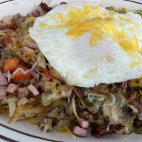 Meat Lover Skillet · Two eggs (Any style) with hash browns topped with Cheddar cheese, ham, bacon, sausage, mushr...