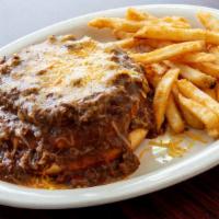 Open Face Chili Cheeseburger · Our juicy burger smothered with delicious chili and topped with Cheddar cheese and onions.