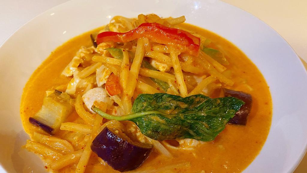 Red Curry · Served with your choice of meat with bamboo shoots, eggplant,bamboo shoot and basil with rich red curry in coconut milk.