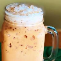 Homemade Thai Iced Tea · Richly spiced and strongly-brewed black tea with ice that's gently mixed with sweetened cond...