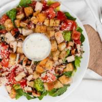 Grilled Chicken Caesar · Char-grilled chicken on a crisp bed of lettuce with tomato, croutons, caesar dressing, and P...