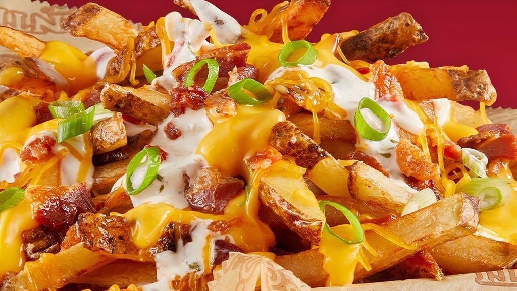 Bacon Cheddar Ranch Fries · Fries topped with bacon, cheddar cheese and Bacon Tomato Ranch sauce